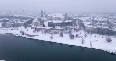 Aerial view of Wawel Royal Castle and Cathedral covered with snow in winter. Gloomy frosty day. Krakow, Poland
