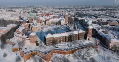 Aerial view of Wawel Royal Castle and Cathedral covered with snow in winter. Sunny frosty day. Krakow, Poland