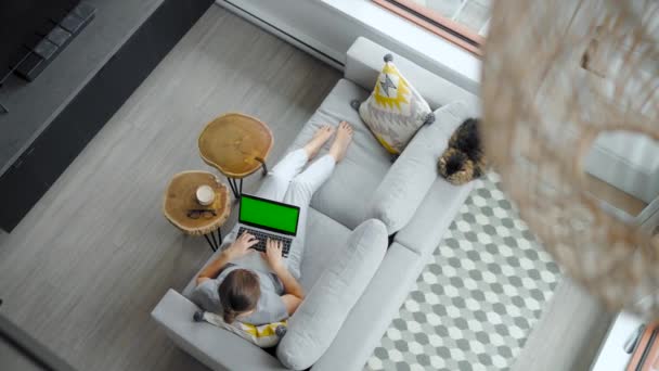 Overhead Shot Woman Using Laptop Green Mock Screen Lying Couch — Stock Video