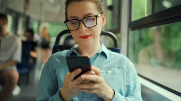 Public Transport Woman Glasses Tram Using Smartphone Chatting Texting Friends — Vídeos de Stock
