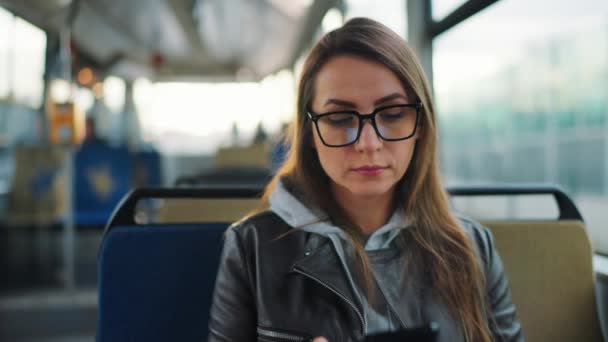 Public Transport Woman Glasses Tram Using Smartphone Chatting Texting Friends — Video