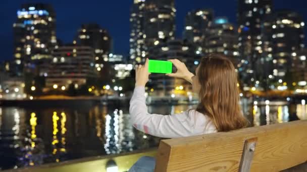 Woman Takes Picture Skyscrapers Vancouver Her Smartphone Green Screen Night — Stock Video