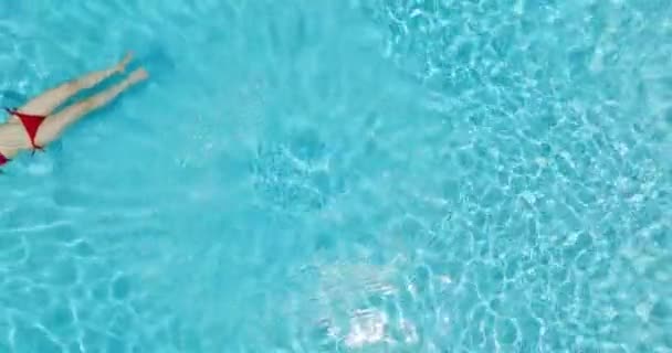 Top View Woman Red Swimsuit Lying Her Back Pool Relaxing — Video