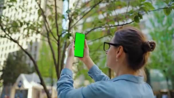 Woman Standing Street Makes Photo Smartphone Green Screen Back View — Stock Video