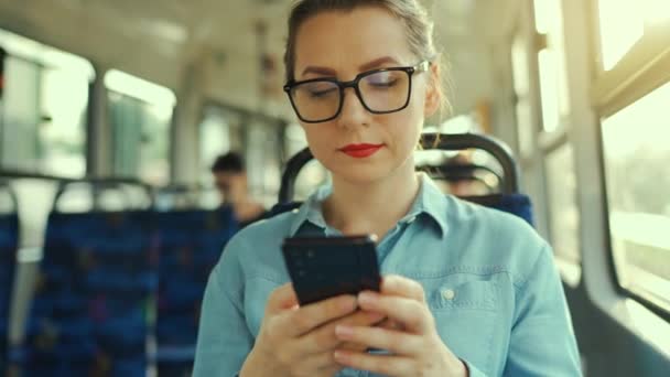 Public Transport Woman Glasses Tram Using Smartphone Chatting Texting Friends — Vídeo de stock