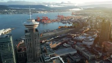 Aerial View Of Vancouver Lookout In Harbour Centre, British Columbia, Canada. Port of Vancouver is on the background. Video filmed at different speed - normal and accelerated.
