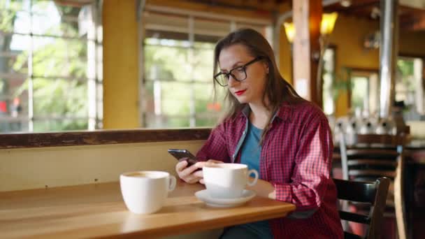 Woman Using Smartphone Drinking Coffee Cafe Urban Lifestyle Texting Sharing — Stock Video