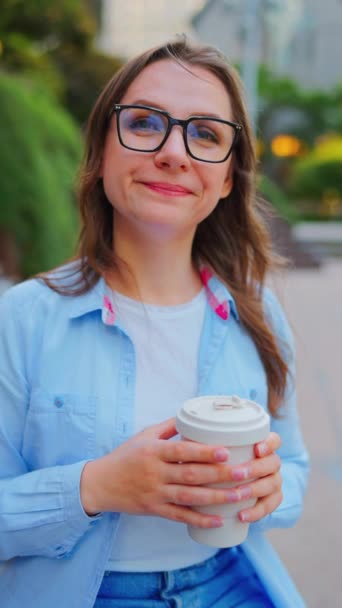 Portrait Woman Glasses Holding Coffee Hands Looking Camera Vertical Video Royalty Free Stock Footage