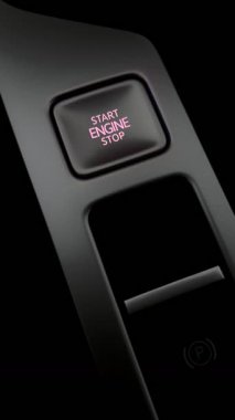 Araba motorunu çalıştırıyorum. Motoru durdurma düğmesinin dikey çekimi. Modern ulaşım ve teknoloji