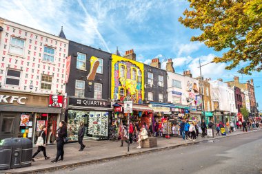 LONDON, ENGLAND - OCTOBER 17, 2022: Houses with colorful decorated facades on High Street in Camden town