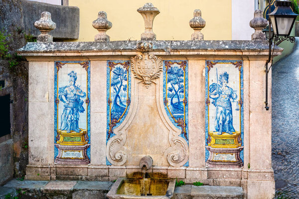 Public fountain Fonte da Pipa was built in 1787 and has four azulejo panels. Sintra, Portugal.