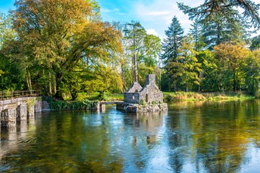 River Cong with ruin of medieval Monk's Fishing house. Cong, County Mayo, Ireland clipart