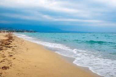 Autumn beach and the rippling Aegean Sea. Nei Pori, Pieria, Greece clipart