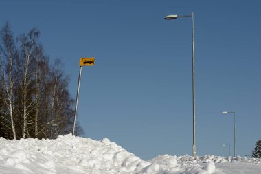 bus stop outside the city in winter on a cloudy day somewhere in Finland