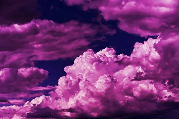 dramatic purple clouds in the dark sky