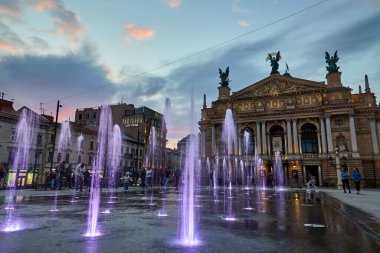 Lviv, Ukraine - April 30 2021: The Solomiya Krushelnytska Lviv State Academic Theater of Opera and Ballet or Lviv Opera and coloful dancing fountains in Lviv Ukraine