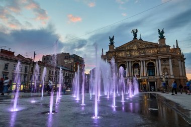 Lviv, Ukraine - April 30 2021: The Solomiya Krushelnytska Lviv State Academic Theater of Opera and Ballet or Lviv Opera and coloful dancing fountains in Lviv Ukraine