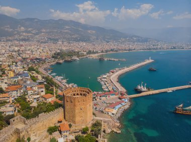 Awesome view of the Kizil Kule by the Mediterranean Sea in Alanya, Turkey. The Red Tower is a popular tourist attraction in Turkey.