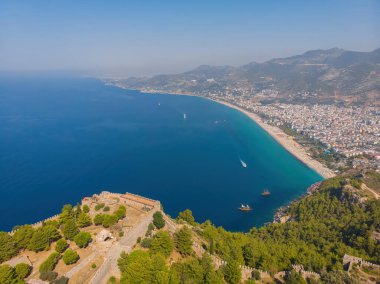 An aerial view of the bay Alanya in Antalya Turkey. Sea and city with an open sky. Kizil Kule - Alanya