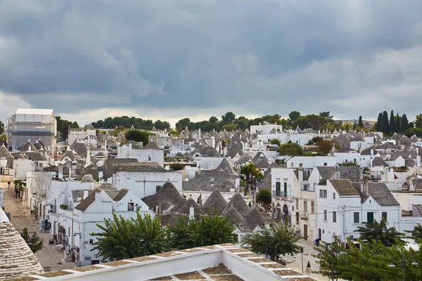 stock image Alberobello, Puglia, Italy: Typical houses built with dry stone walls and conical roofs of the Trulli, in a beautiful day, Apulia