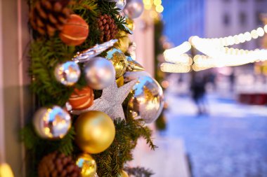 Christmas and New Year time, amazing Xmas decorations on pine trees with real snow, blurred background
