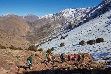 Hiking to the summit of Jebel Toubkal, highest mountain of Morocco. clipart