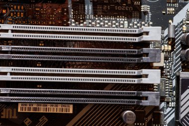 A detailed view of RAM slots on a motherboard, showcasing the connection points and layout for installing memory modules. Perfect for tech-related content, tutorials, or backgrounds in electronics and computing. clipart