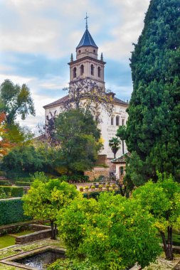 Cathedral and garden in famous Alhambra palace in Spain