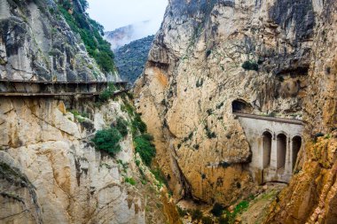 Deep canyon next to mountain path El Caminito del Rey in El Chorro Spain