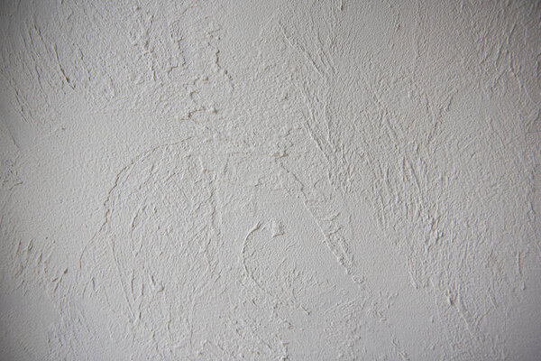 Grey plaster background, cracked and textured leaden cement