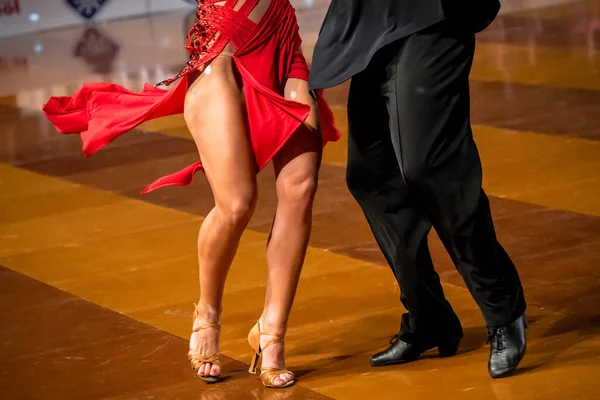 The couple dance a Latin dance. the legs of a dancing couple