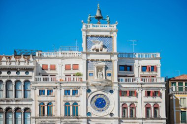 St Mark Clocktower with clock and statues. View from Piazza San Marco, Venice, Italy clipart