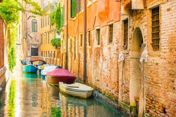 stock image Morning in Venice street with canal, boats and gondolas