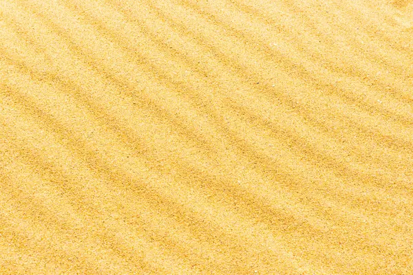 自然熱帯背景として波が付いている浜の砂のテクスチャ ストック画像