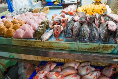 Stall with fresh fish and seafood at traditional asian street market