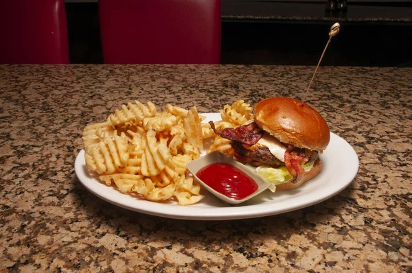 stock image All American classic bacon cheeseburger on a sesame seed bun.