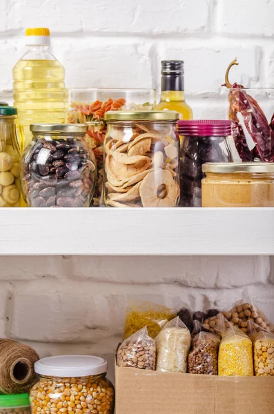 Set Non Perishable Foods Pantry Shelf Brick Wall Background — Stock Photo, Image