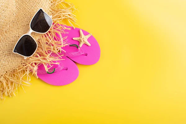 stock image Flip flops straw hat sunglesses and starfish on yellow background vacation travel planning mockup