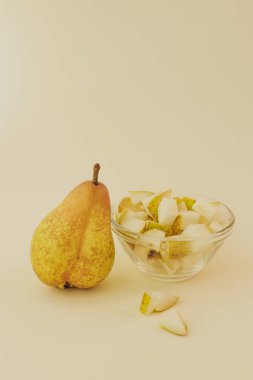 Fresh pear on background. Healthy raw food, dessert without sugar and flour. For text and articles on health. The concept of zero waste, pesticide-free and eco-friendly clipart