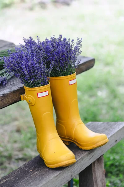 Bouquets Lavender Yellow Rubber Boots Background Garde — Φωτογραφία Αρχείου