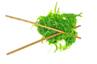 Wakame seaweed and chopsticks isolated on white background