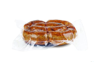 Grilled homemade sausage packaged in vacuum plastic packet isolated on white background