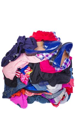 Big pile of old, used clothes isolated on white background