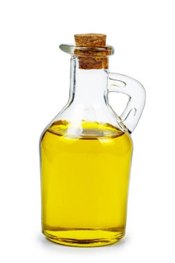 Tecavüz tohumu (ya da zeytin, ya da mısır, ayçiçeği tohumları) beyaz arkaplanda izole edilmiş cam sürahide yağdır
