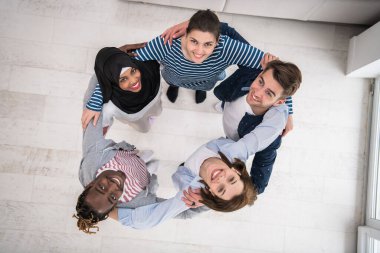 Top view of a diverse group of people symbolizes togetherness. High quality photo clipart