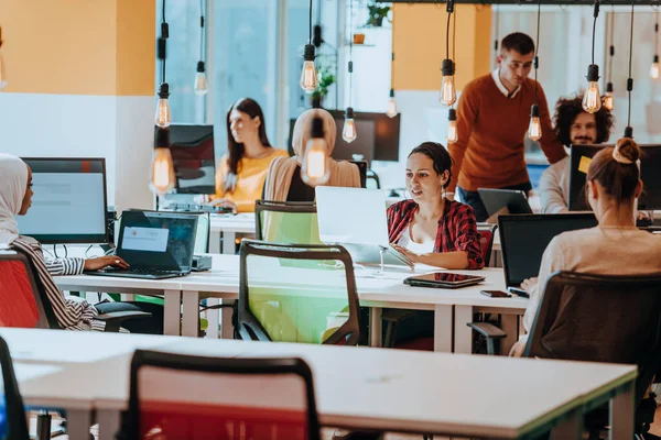 stock image Multiethnic group of employees working in a marketing company. A group of colleagues is working on a project in modern offices