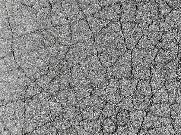 碎裂的沥青路面 有裂缝的人行道纹理图案背景 高质量的照片 — 图库照片