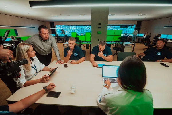 Group Security Guards Sitting Having Briefing System Control Room Theyre — Stok fotoğraf
