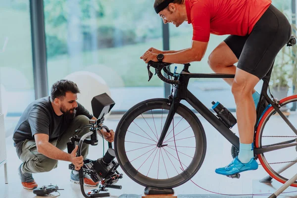 Cameraman Filming Athlete Riding Triathlon Bike Simulation Machine Modern Living — Stock Photo, Image