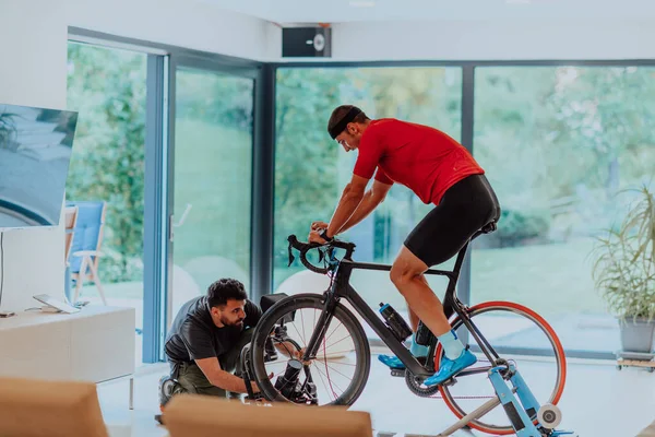 Cameraman Filming Athlete Riding Triathlon Bike Simulation Machine Modern Living — Stock Photo, Image